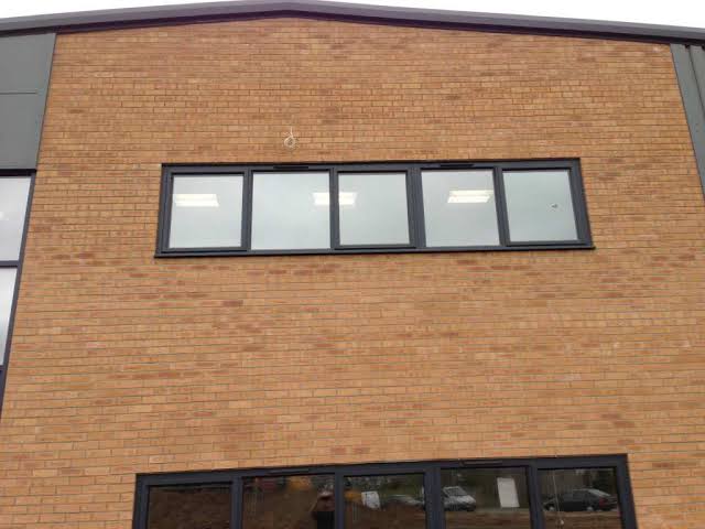 Window film on a brick office building